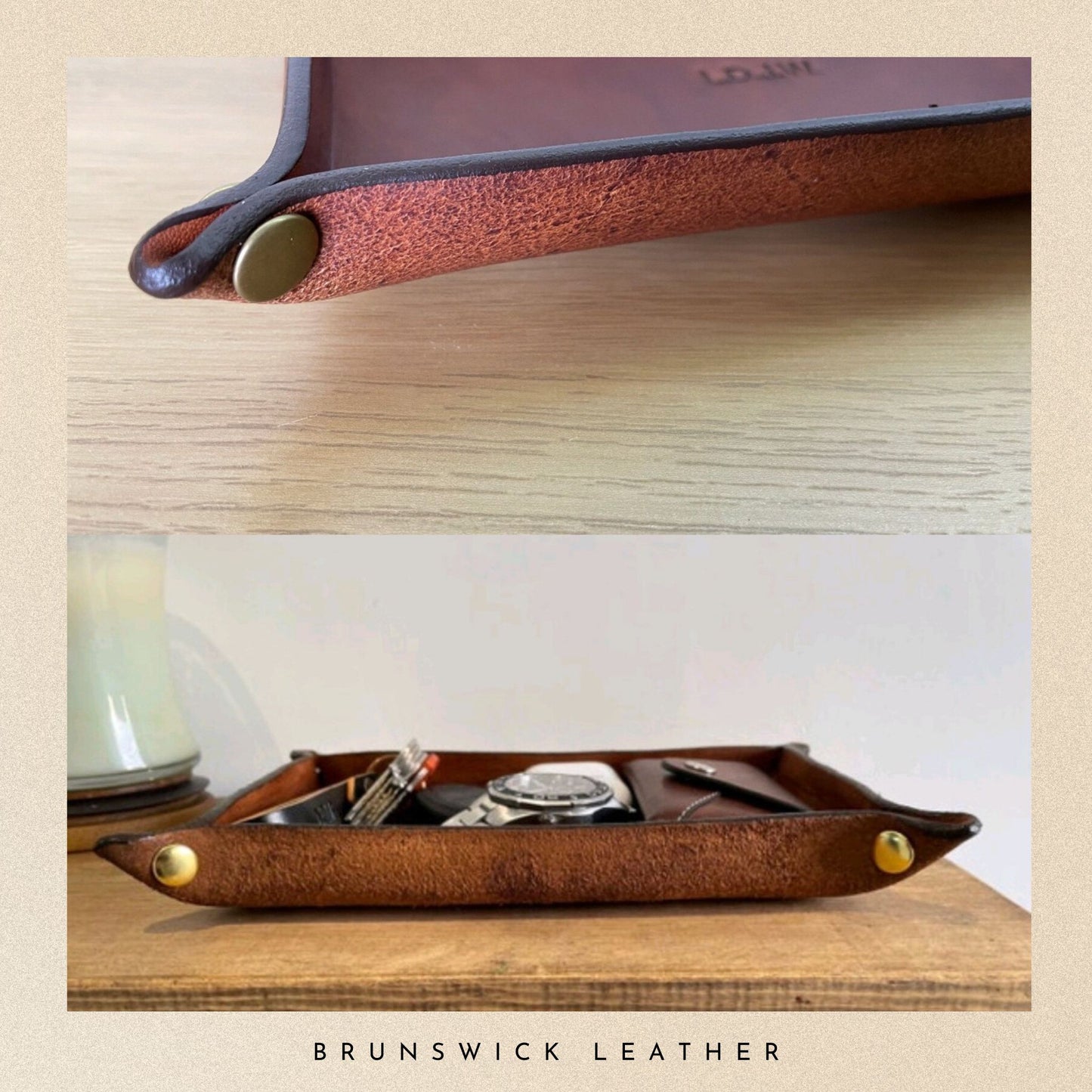Brown leather tray with gold accents on a wooden surface, featuring the brand 'Brunswick Leather'.