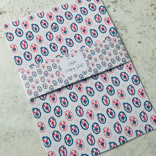 Two patterned lobster a4 sheets on a textured surface