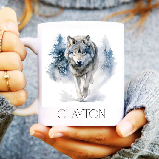 Person holding a mug with a wolf design and the name 'Clayton' on it.