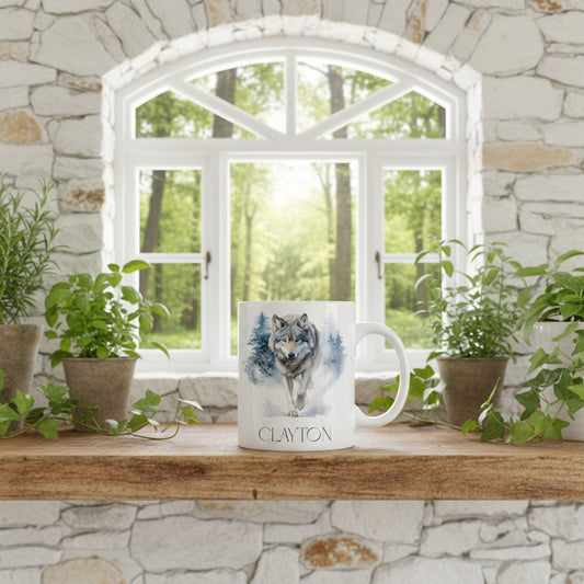 Mug with wolf design on a wooden surface in front of a window with a view of trees.