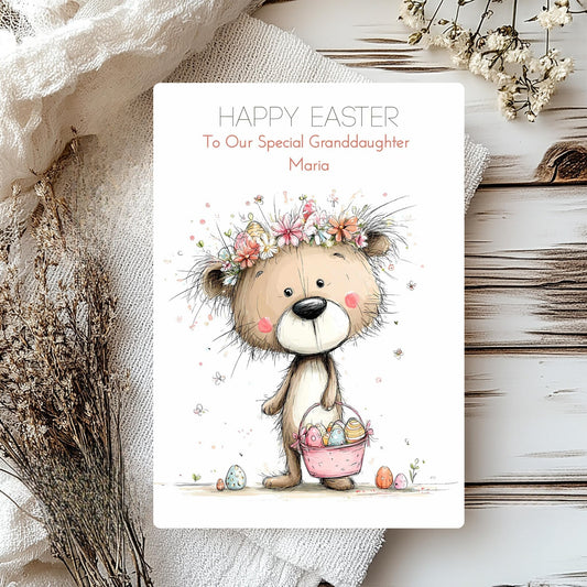 Easter card with a teddy bear holding a basket of eggs, surrounded by flowers and text.
