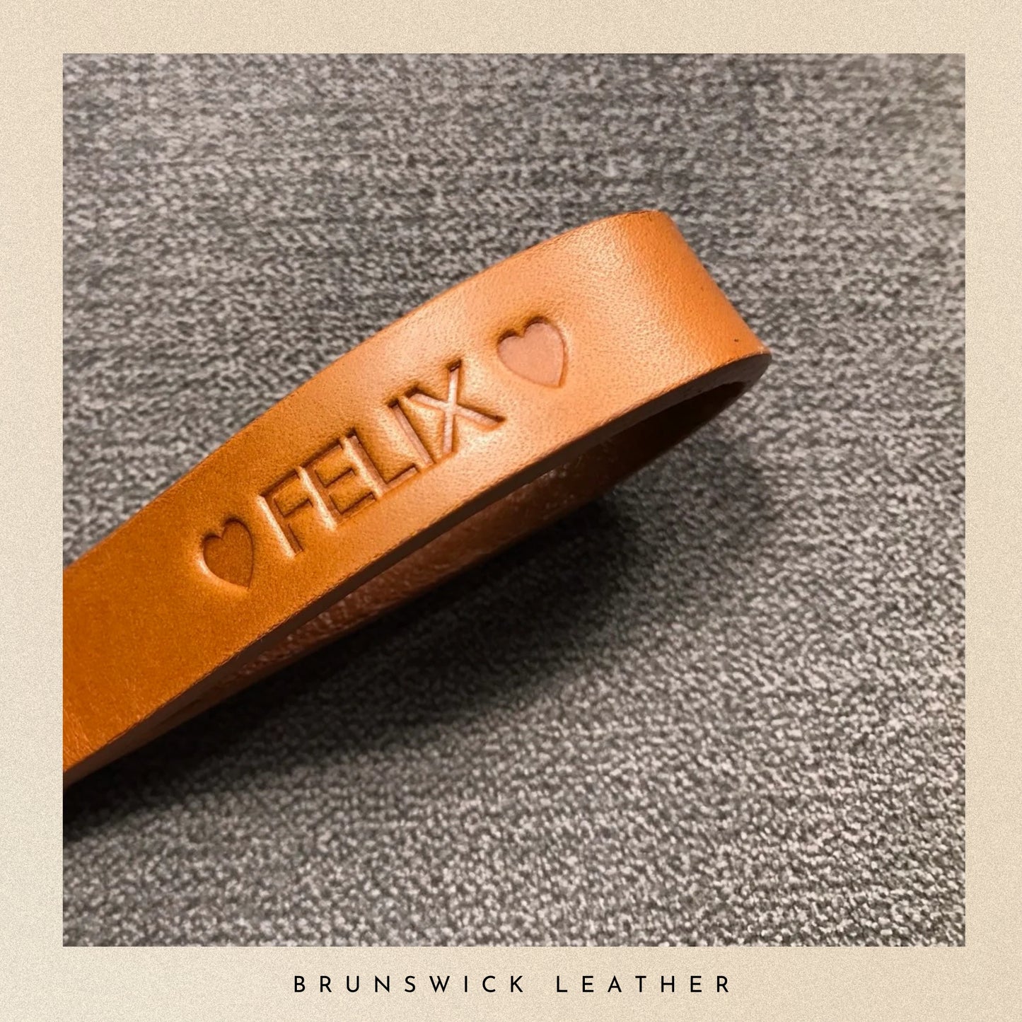 Brown leather strap with 'FELIX' embossed on a textured surface, branded 'Brunswick Leather'.