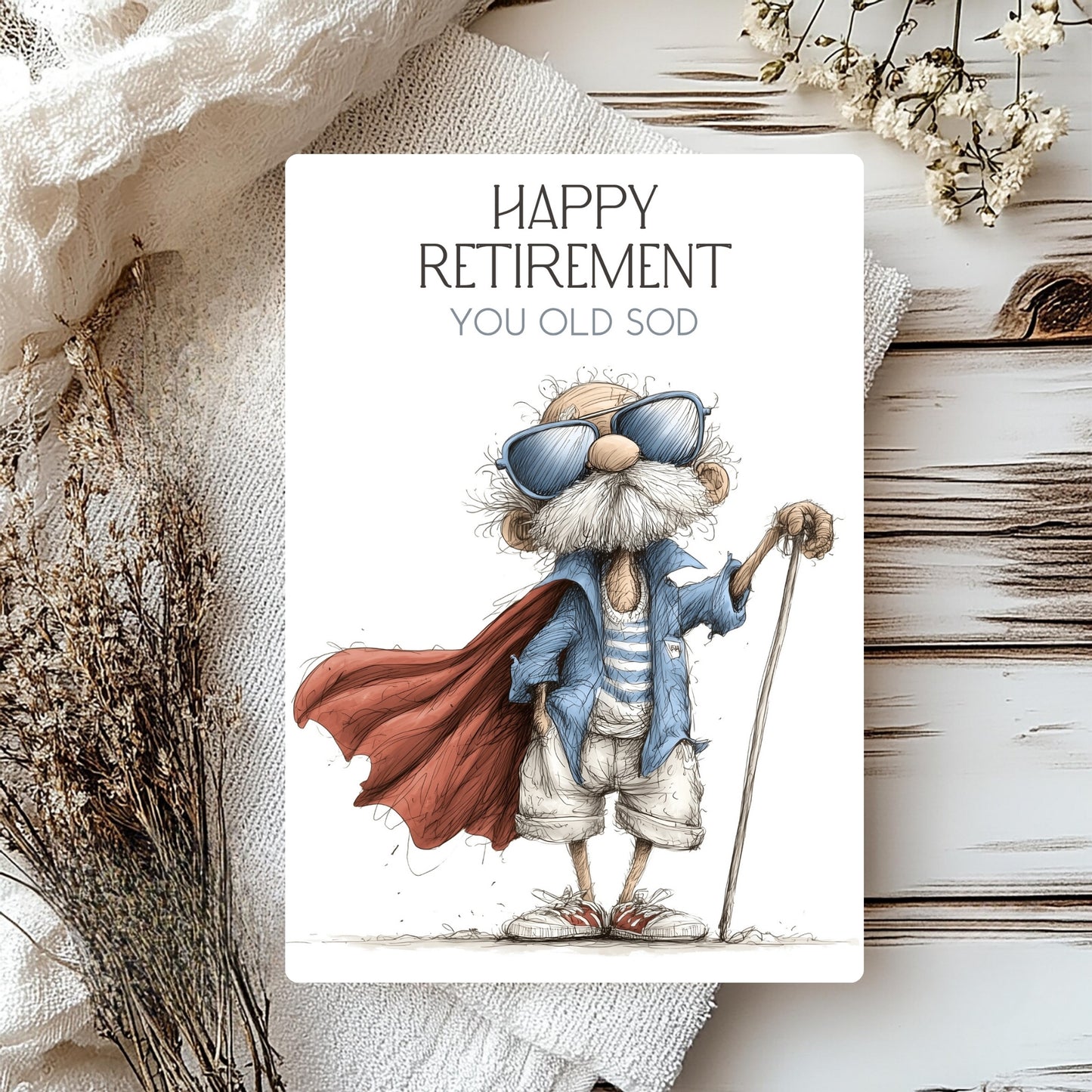 Cartoon character with a cape and sunglasses on a 'Happy Retirement' card with decorative elements.