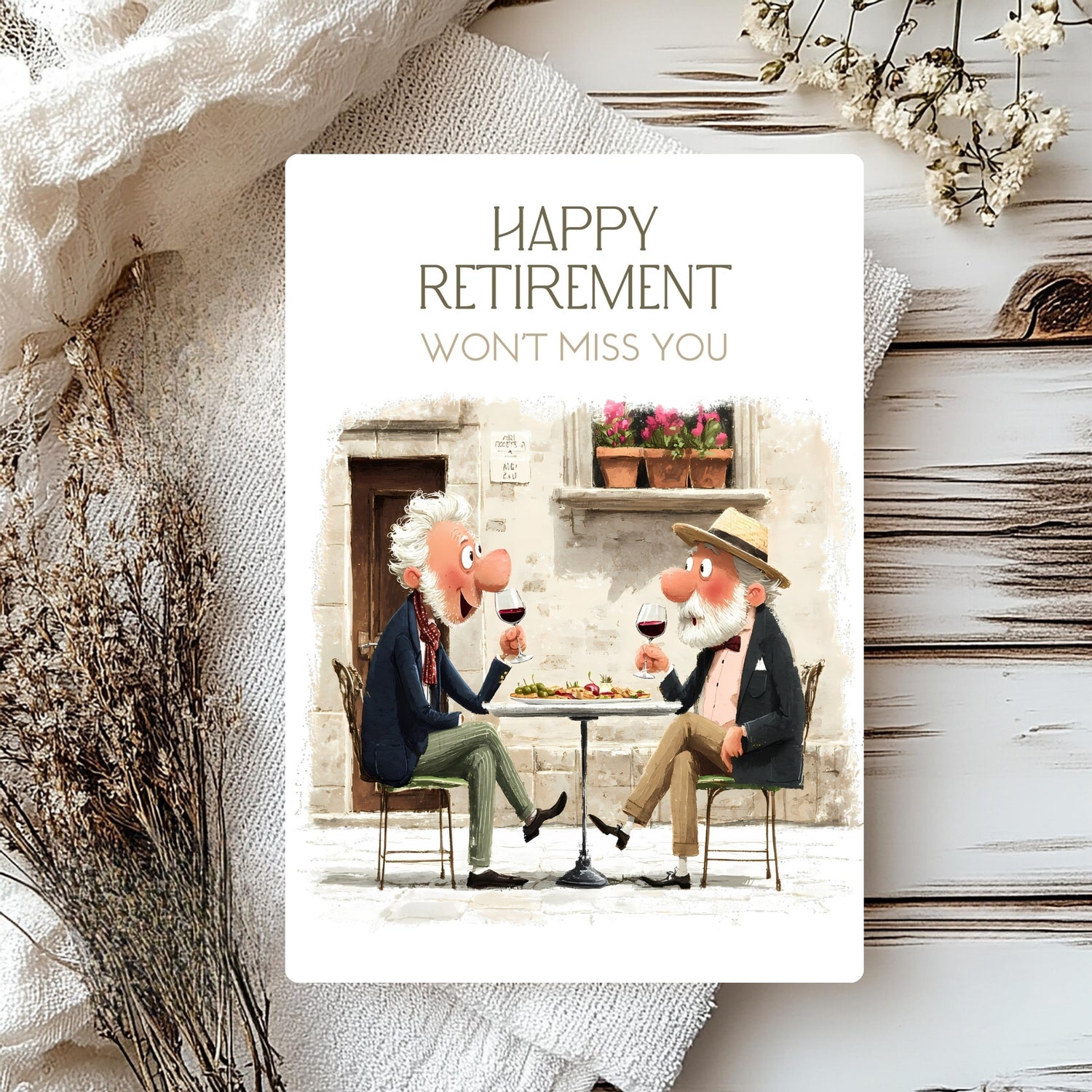 Retirement card with cartoon characters sitting at a table, surrounded by decorative elements.