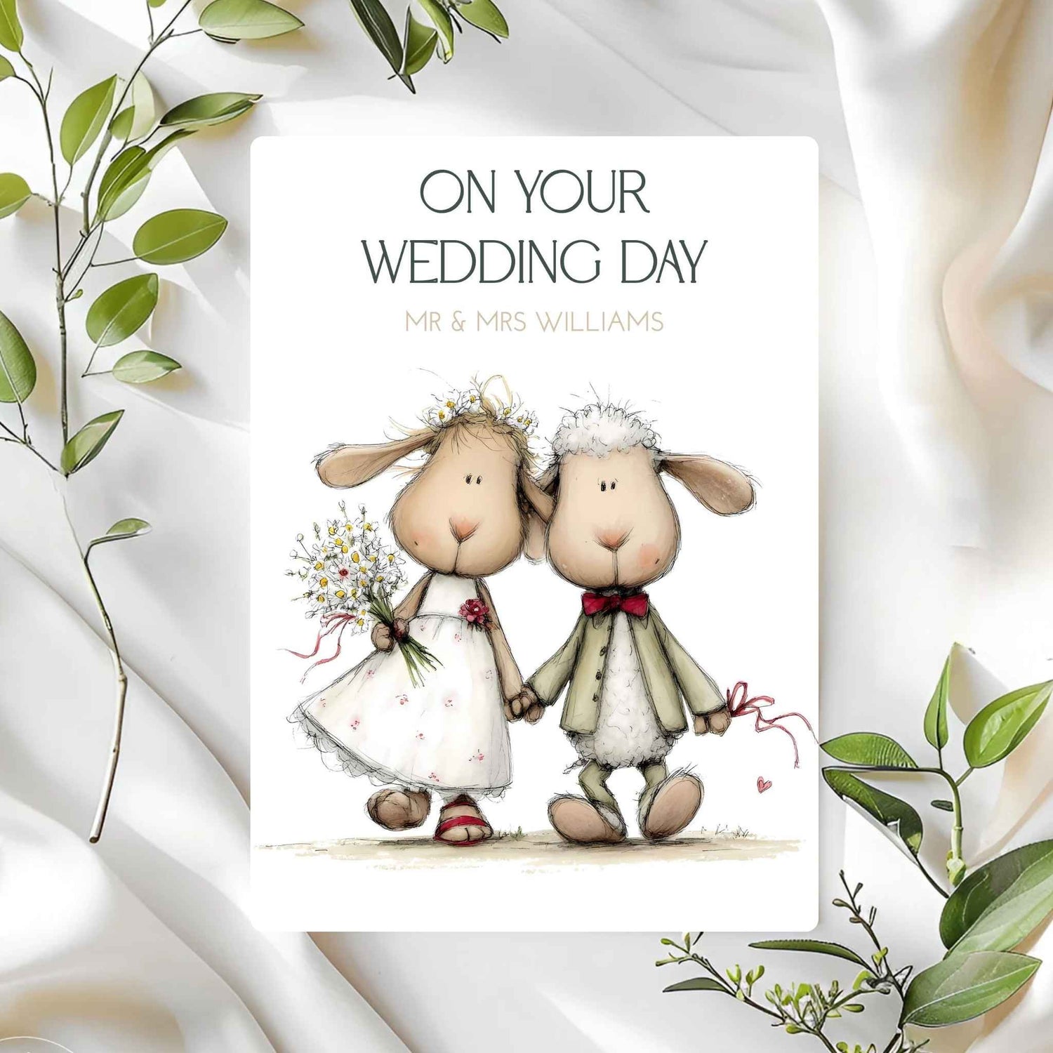 Wedding card with cartoon sheep couple on a white background with green leaves.