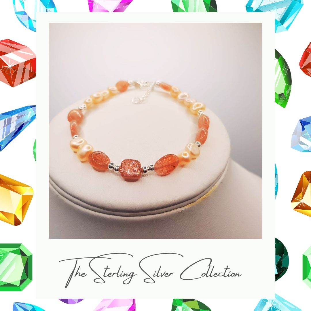 Orange and peach freshwater sterling silver bracelet on a beige background.
