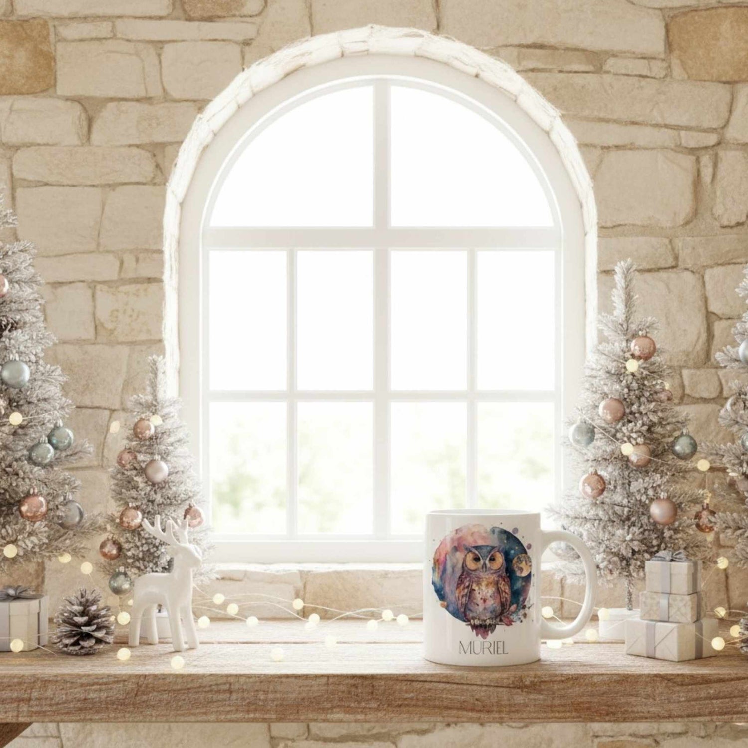 Mug with owl design on a windowsill with Christmas decorations