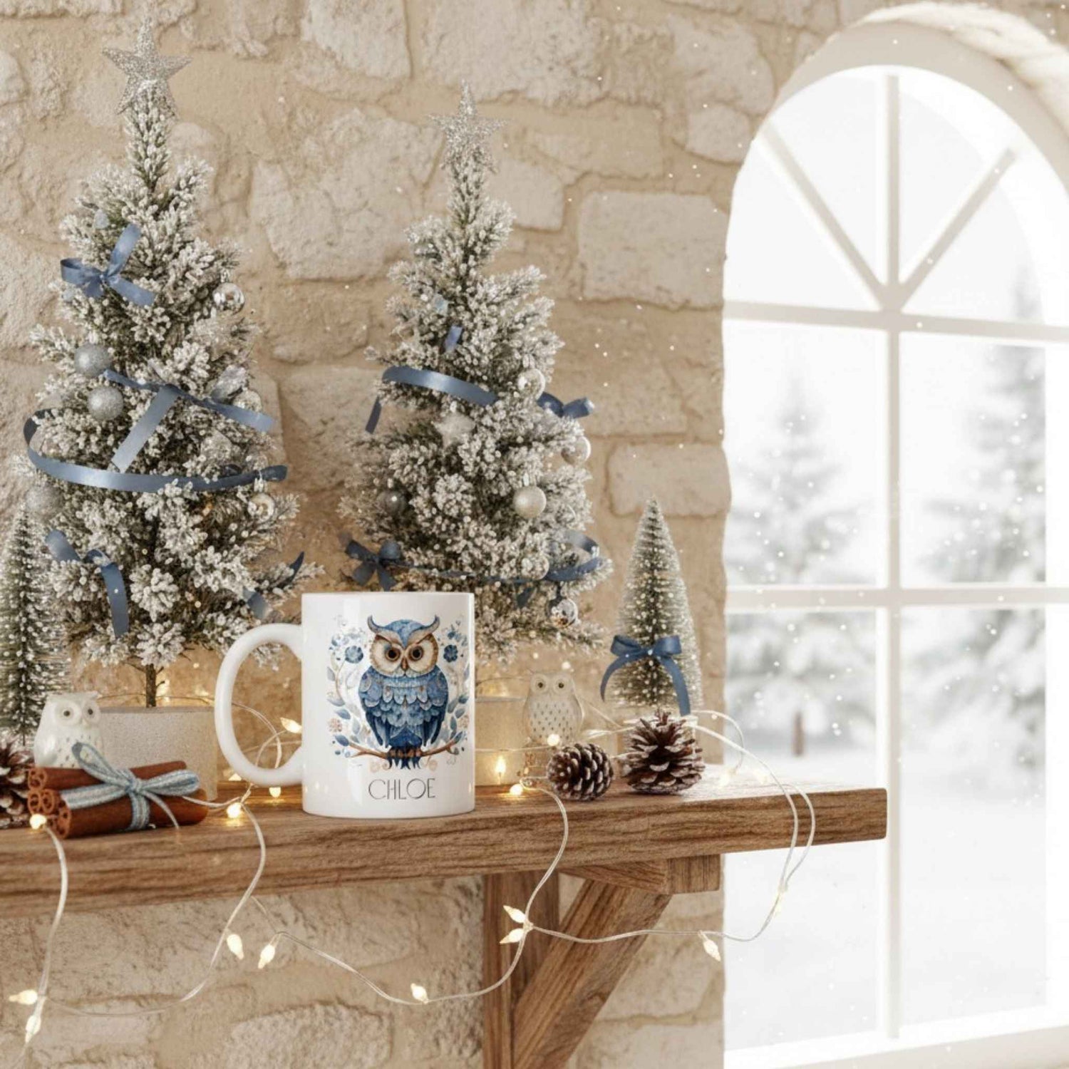 Decorative setup with Christmas trees and a mug featuring an owl design on a stone wall background.