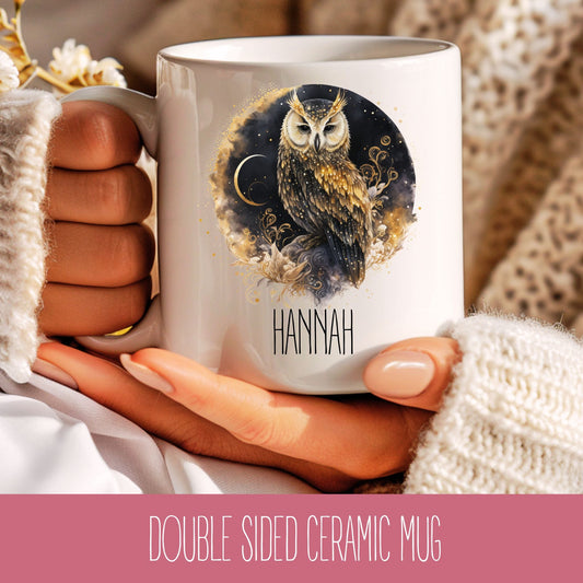 A white ceramic mug with a brown owl illustration and the name 'Hannah' printed on the side, held in a person's hand.