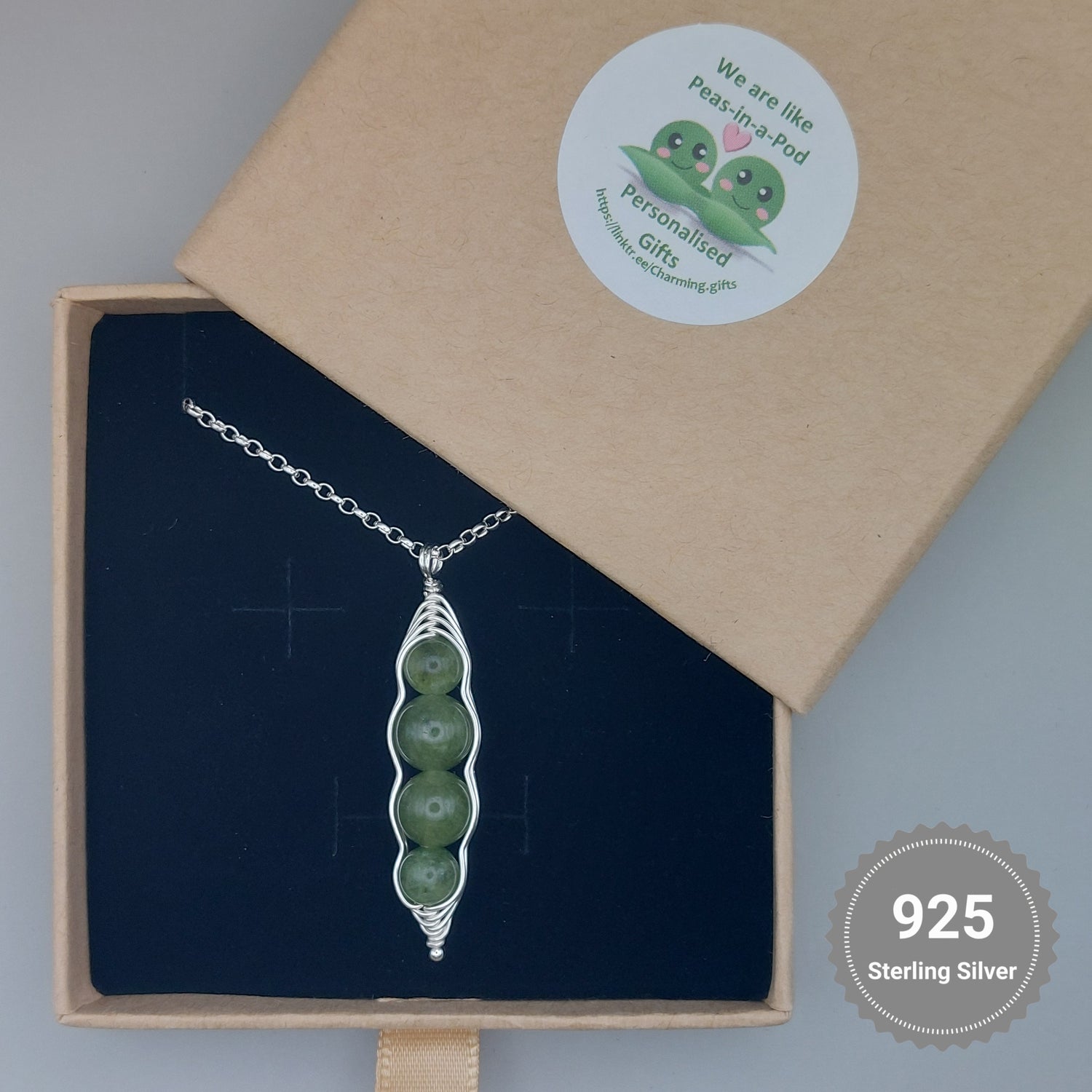 4 peas in a pod necklace in a gift box