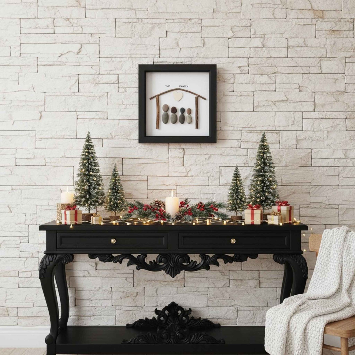 Pebble artwork above ornate console table with Christmas decorations