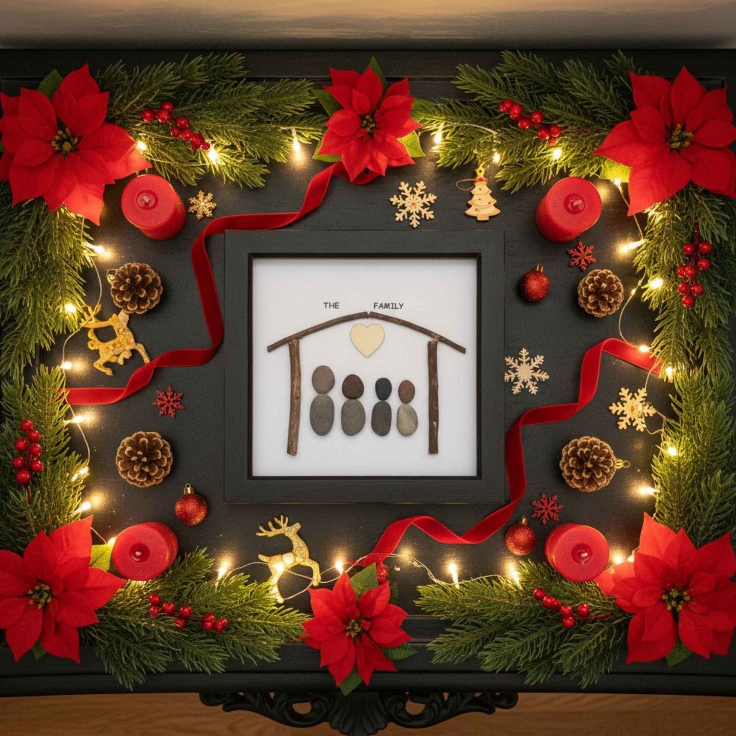 Family pebble art surrounded by festive flowers and decorations