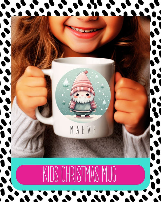 A child holding a white ceramic mug with a cartoon gnome design and the child's name 'Katie' on the mug.