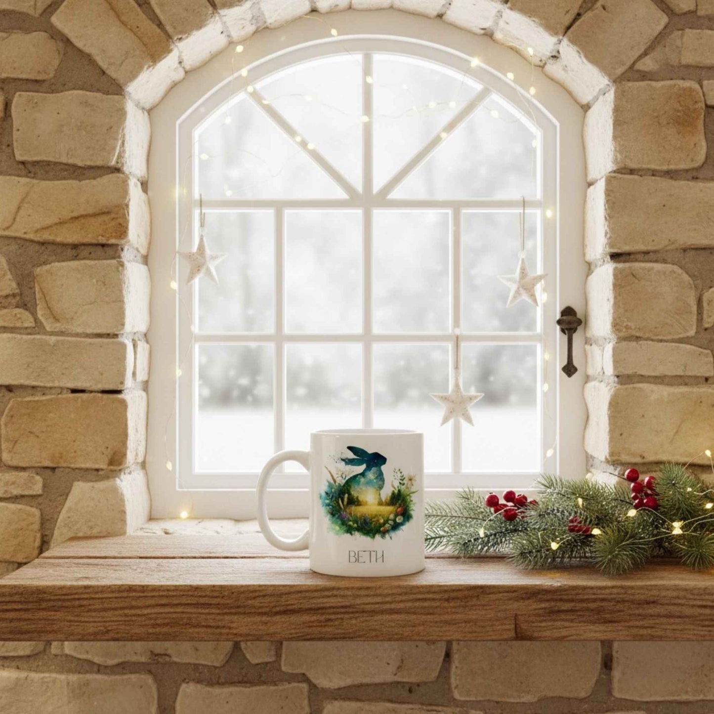 Hare mug with a decorative design on a windowsill with festive decorations and a stone wall background.
