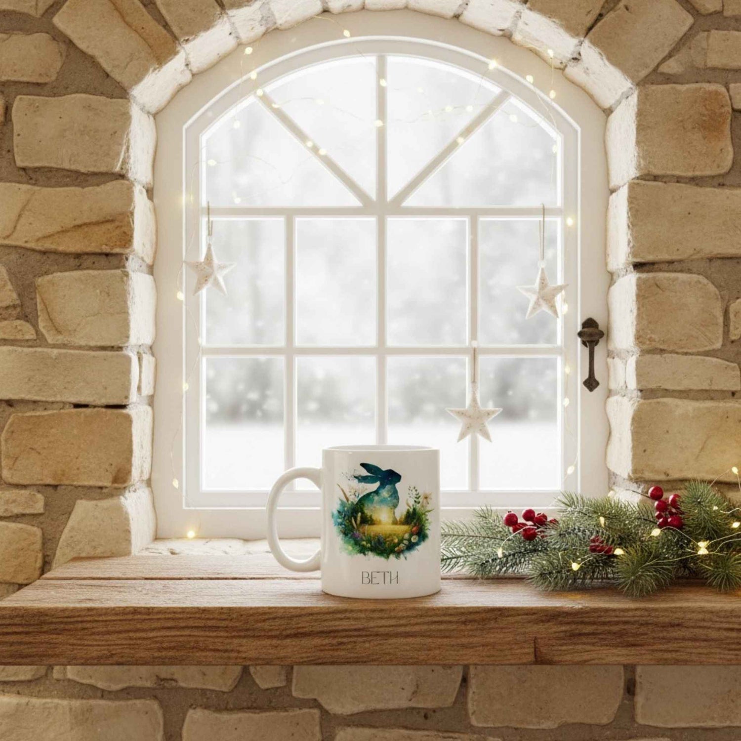 Hare mug with a decorative design on a windowsill with festive decorations and a stone wall background.