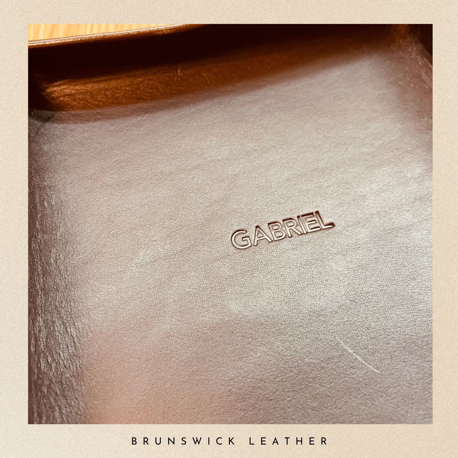 Close-up of a leather surface with 'GABRIEL' branding, labeled 'Brunswick Leather'.