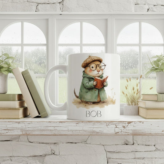Mug with a cartoon mole character reading a book, placed on a windowsill with books and plants.