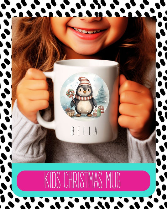 A child holding a white ceramic mug with a personalised name 'Bella' and a penguin design on it, against a background with a leopard print pattern.