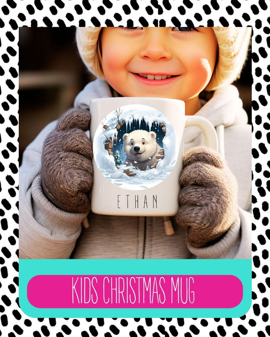A child holding a white ceramic mug with a polar bear design and the child's name 'Ethan' on the mug.