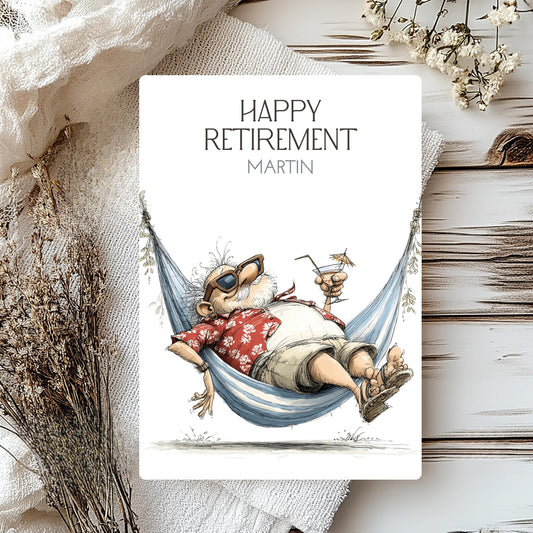 Happy Retirement card with a cartoon character relaxing in a hammock, surrounded by decorative elements on a wooden surface.