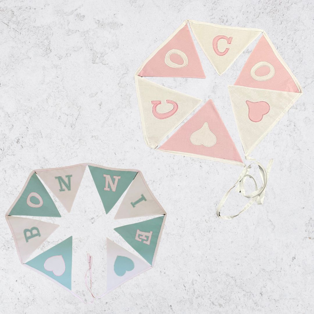 Image of baby blue and baby pink personalised bunting for a childs nursery