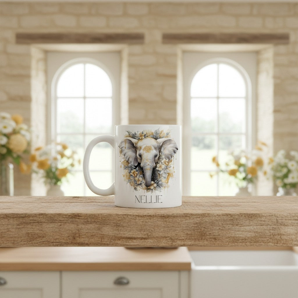 White mug with an elephant design and 'NELLIE' text on a kitchen counter.