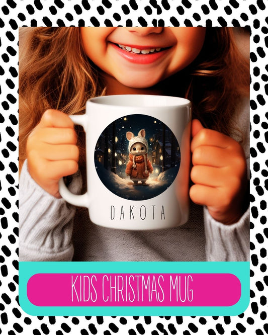 A child holding a ceramic mug with a Christmas themed design, including a rabbit and text 'DAKOTA Kids Christmas Mug'. The background has a polka dot pattern.
