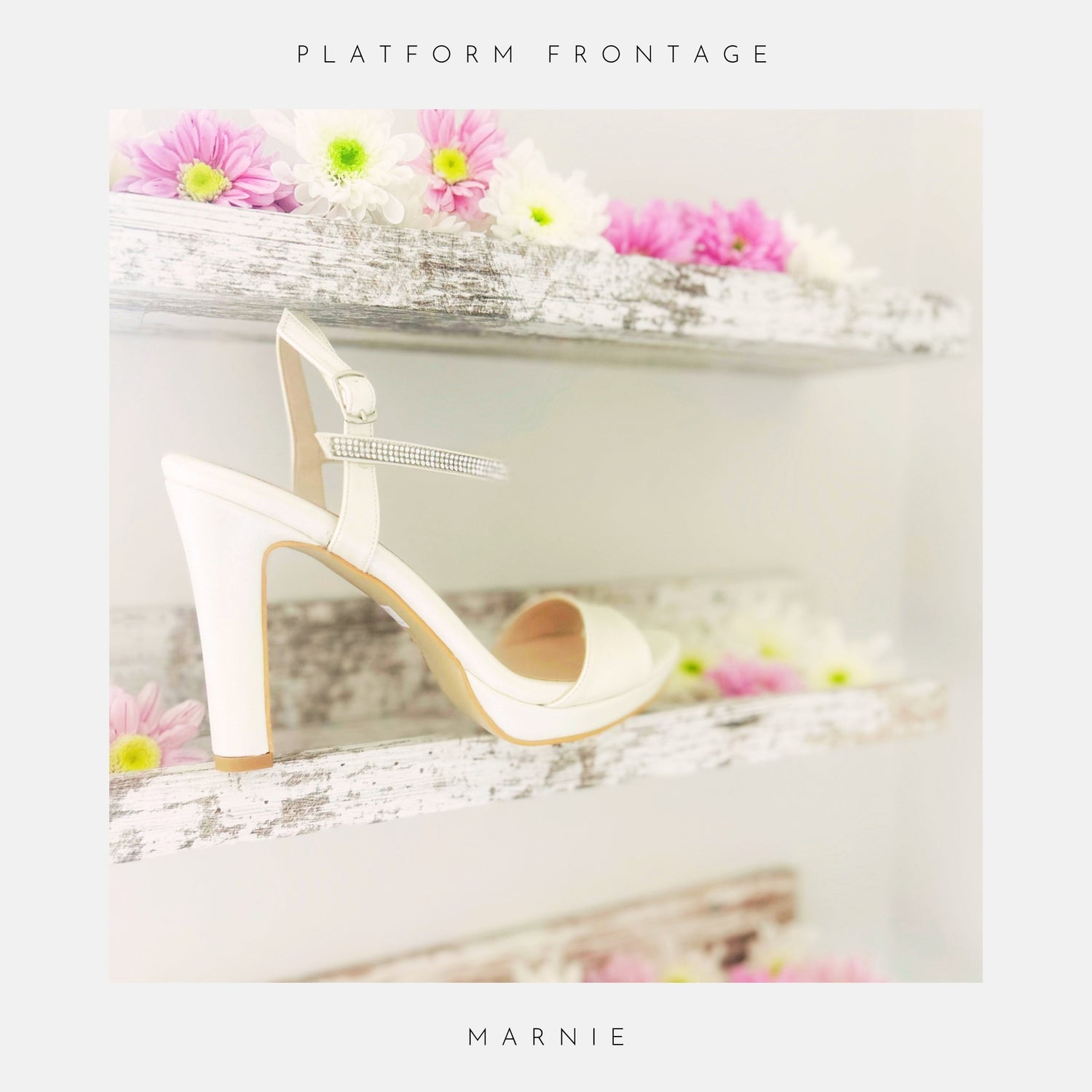 Ivory high-heeled platform bridal shoes on a decorative surface with flowers