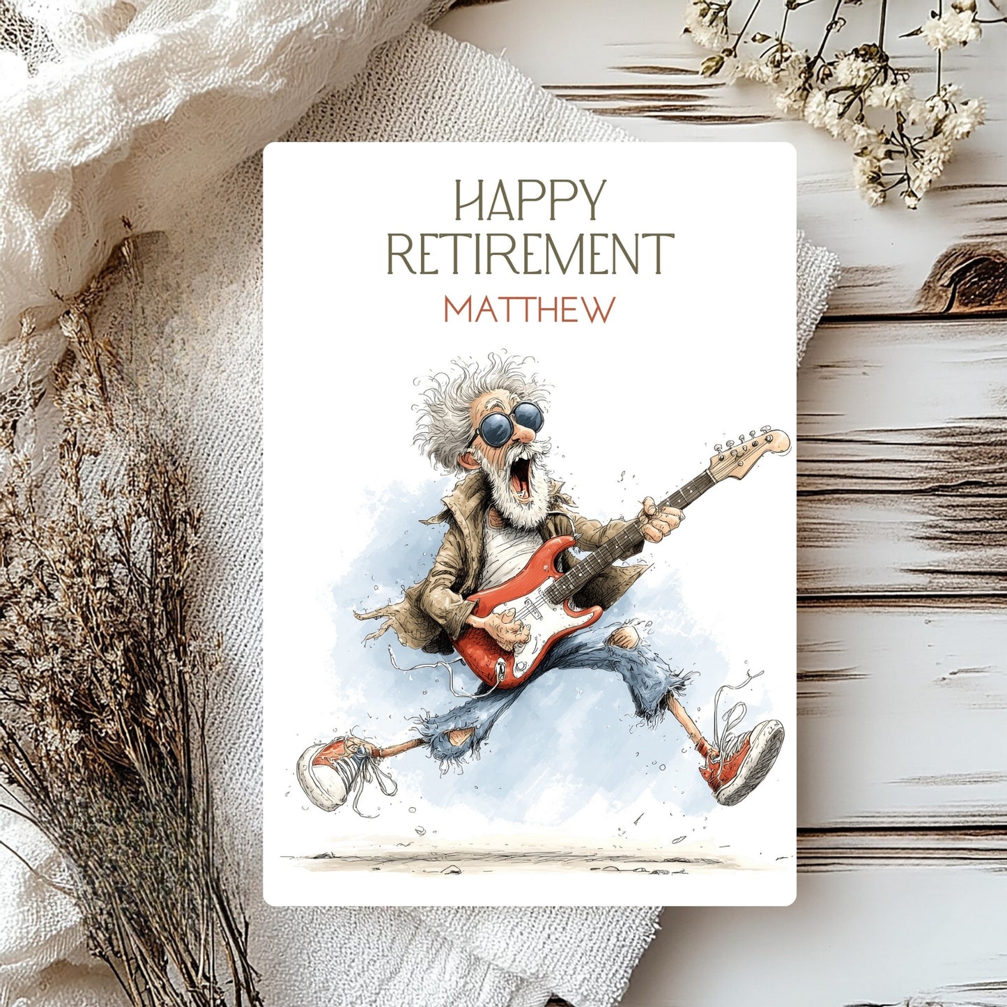 Happy Retirement card with a guitar-playing illustration on a textured surface with flowers.