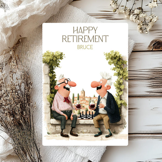 Happy Retirement card with cartoon characters enjoying wine and a game of chess, placed on a textured surface with decorative elements.