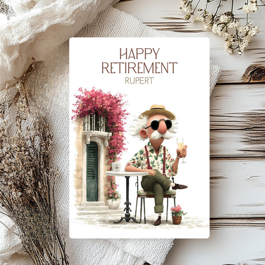 Retirement card with a cartoon character sitting at a table, surrounded by flowers and decorative elements.