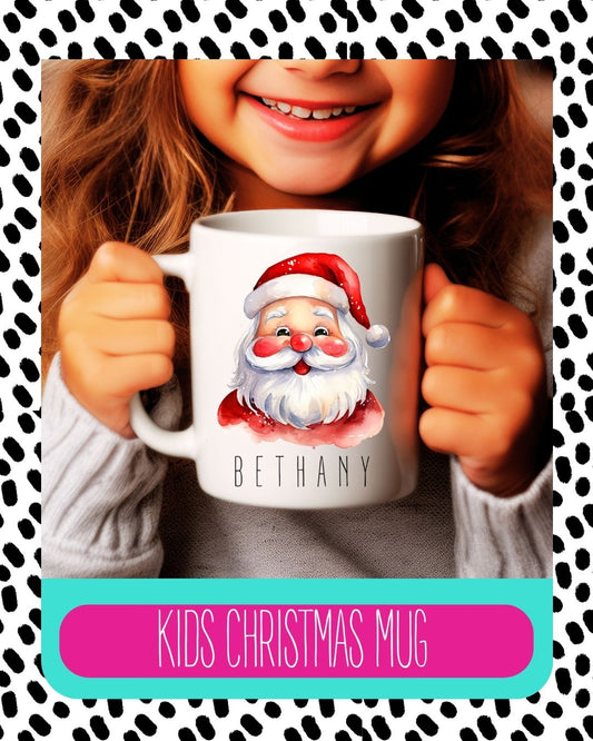 A ceramic mug with a Santa Claus design, being held by a smiling person with the name 'Bethany' printed on it. The mug has a white background with a black and red Santa Claus illustration and the text 'Kids Christmas Mug'.