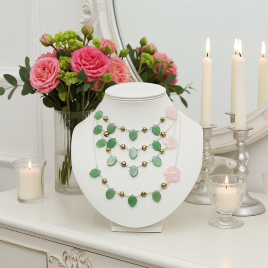 Semi Precious Bead Necklace on a mannequin bust with flowers and candles in the background