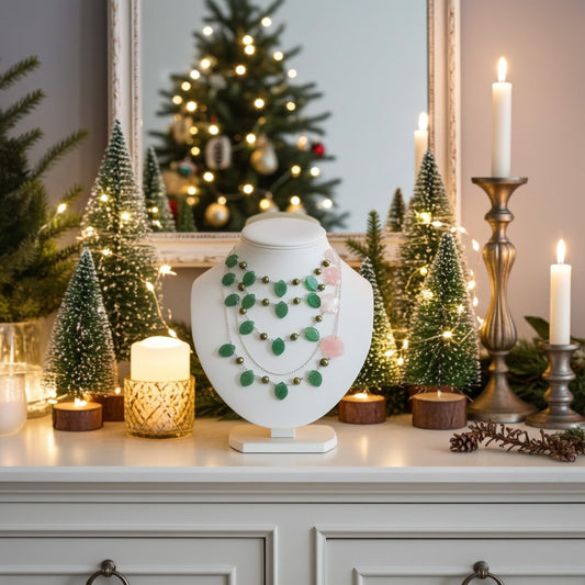 Semi precious bead necklace on a stand with Christmas decorations in the background