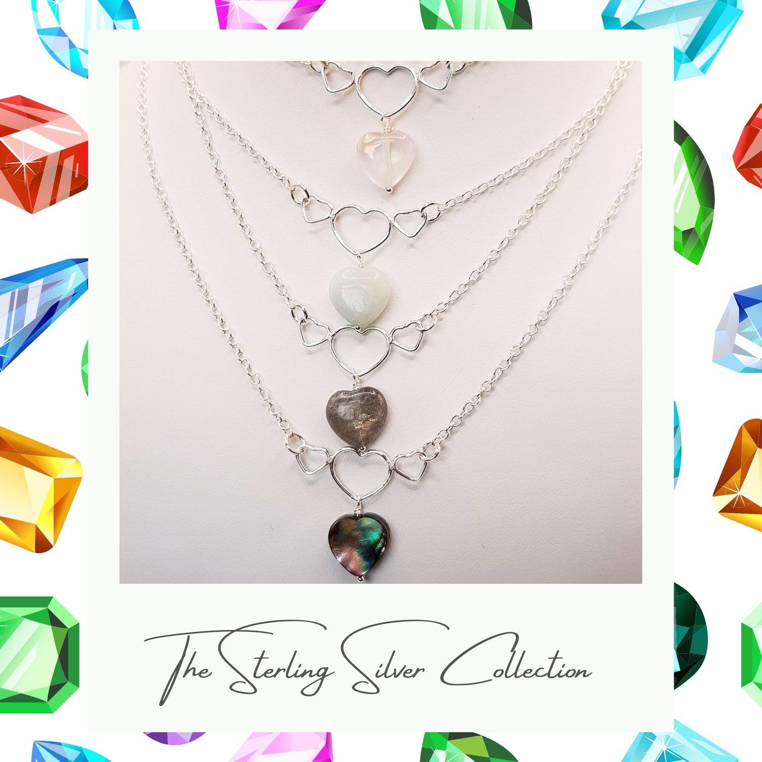 Series of heart necklaces on sterling silver chains close up.