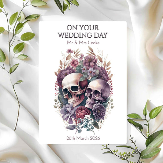 Wedding card with skulls and flowers on a white fabric background