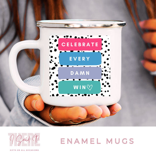 A white ceramic mug with a colourful text pattern that reads CELEBRATE EVERY DAMN DAY