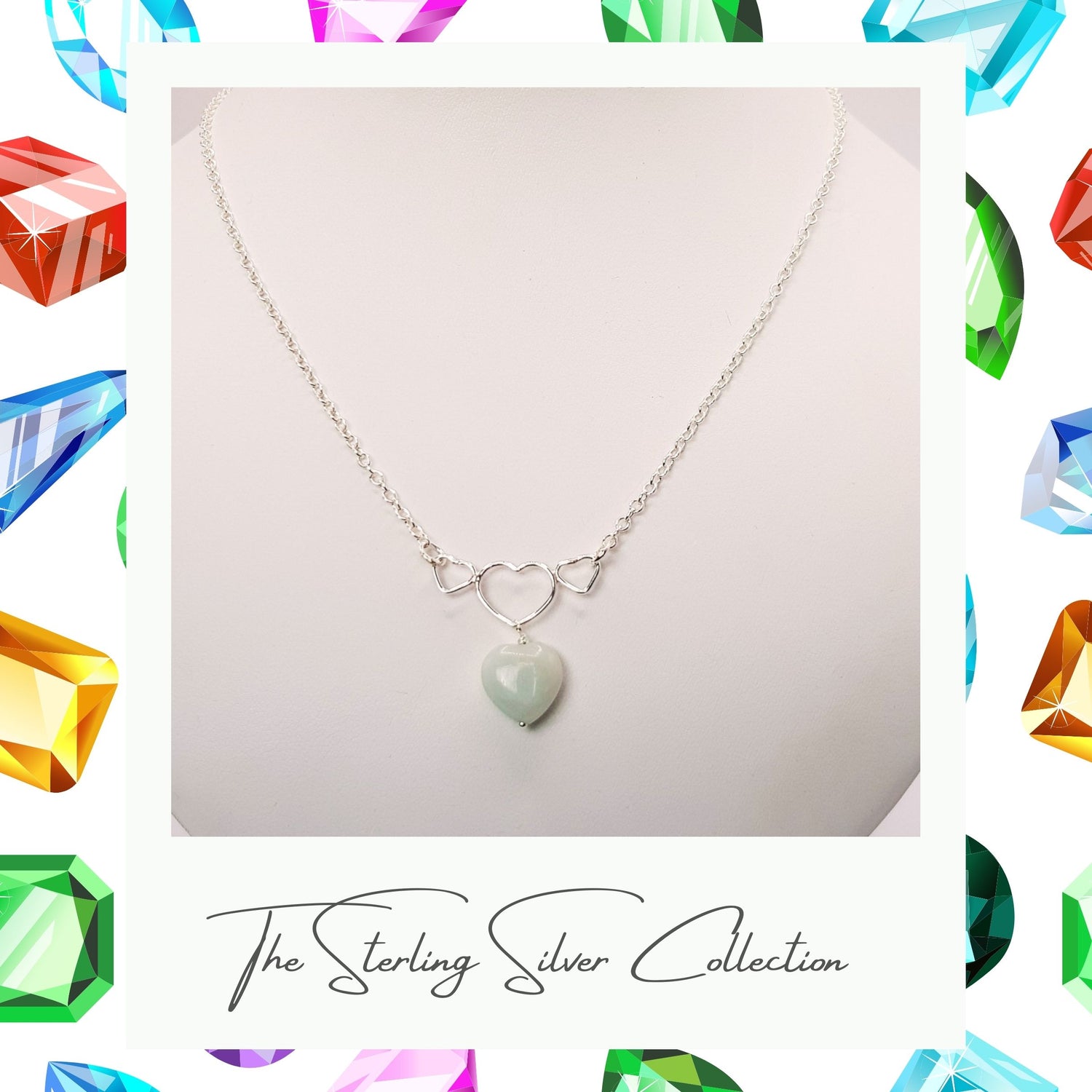 Heart necklace with three smaller hearts on a necklace stand.