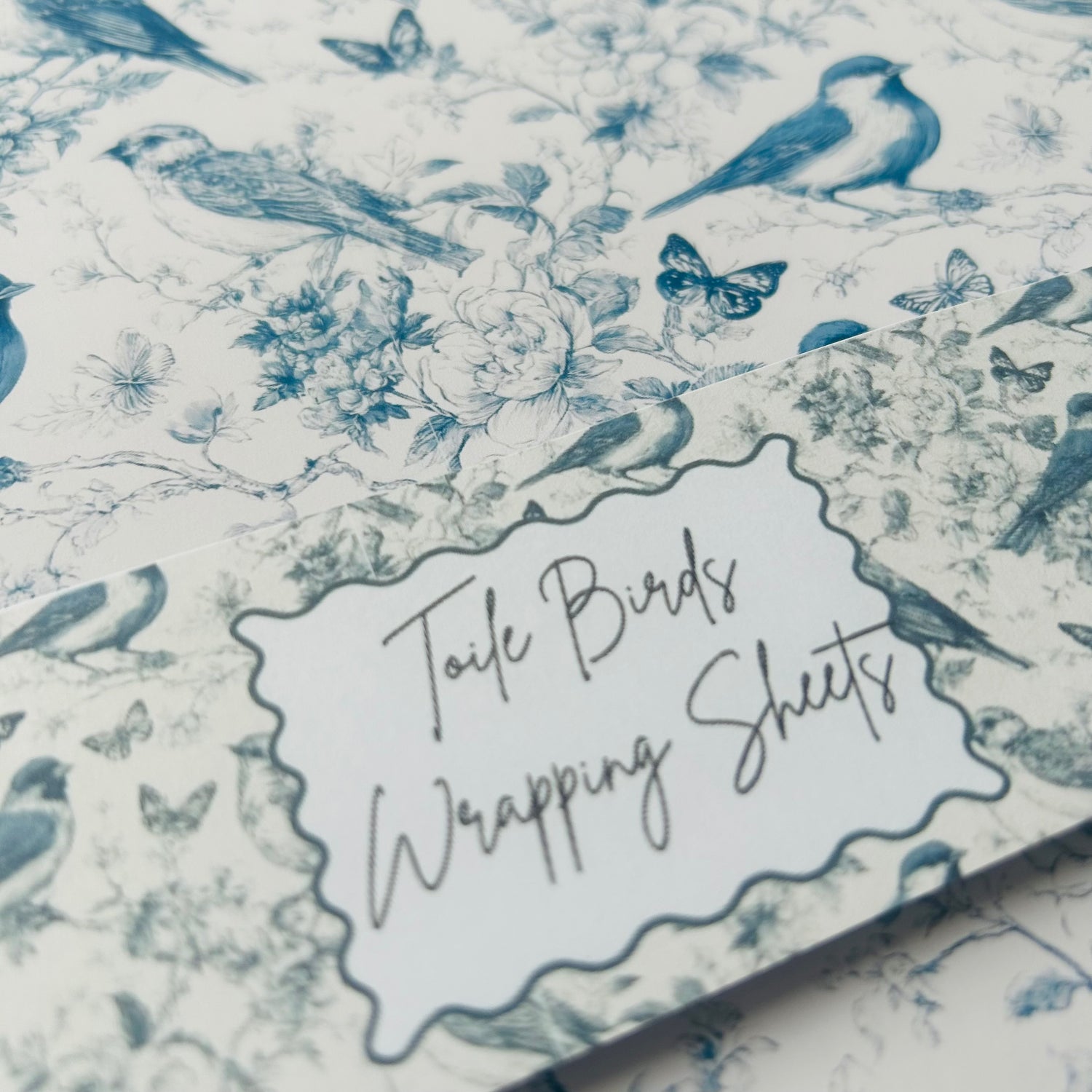 Birds and floral patterned wrapping paper with 'Toile Birds Wrapping Sheets' label.