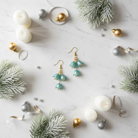Tulip Christmas earrings surrounded by candles and festive decorations.