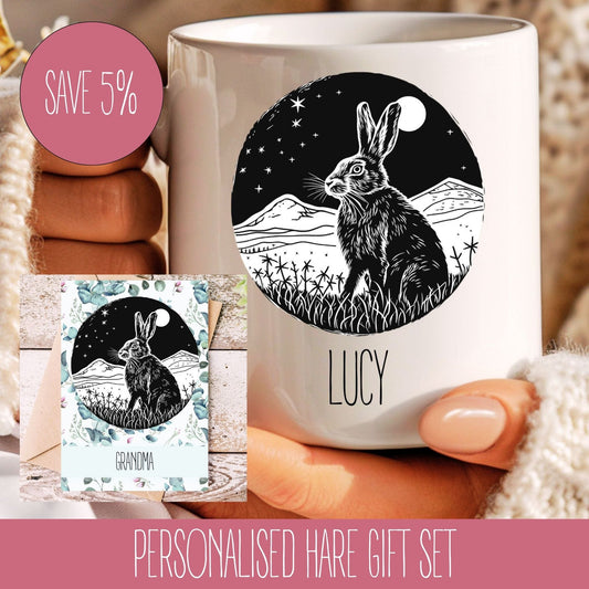 A personalised gift set featuring a white mug with a black and white illustration of a hare and the name 'LUCY' on it, along with a matching A5 card.