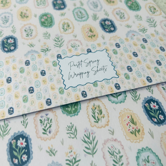 Pastel spring wrapping sheets with floral patterns and a label.