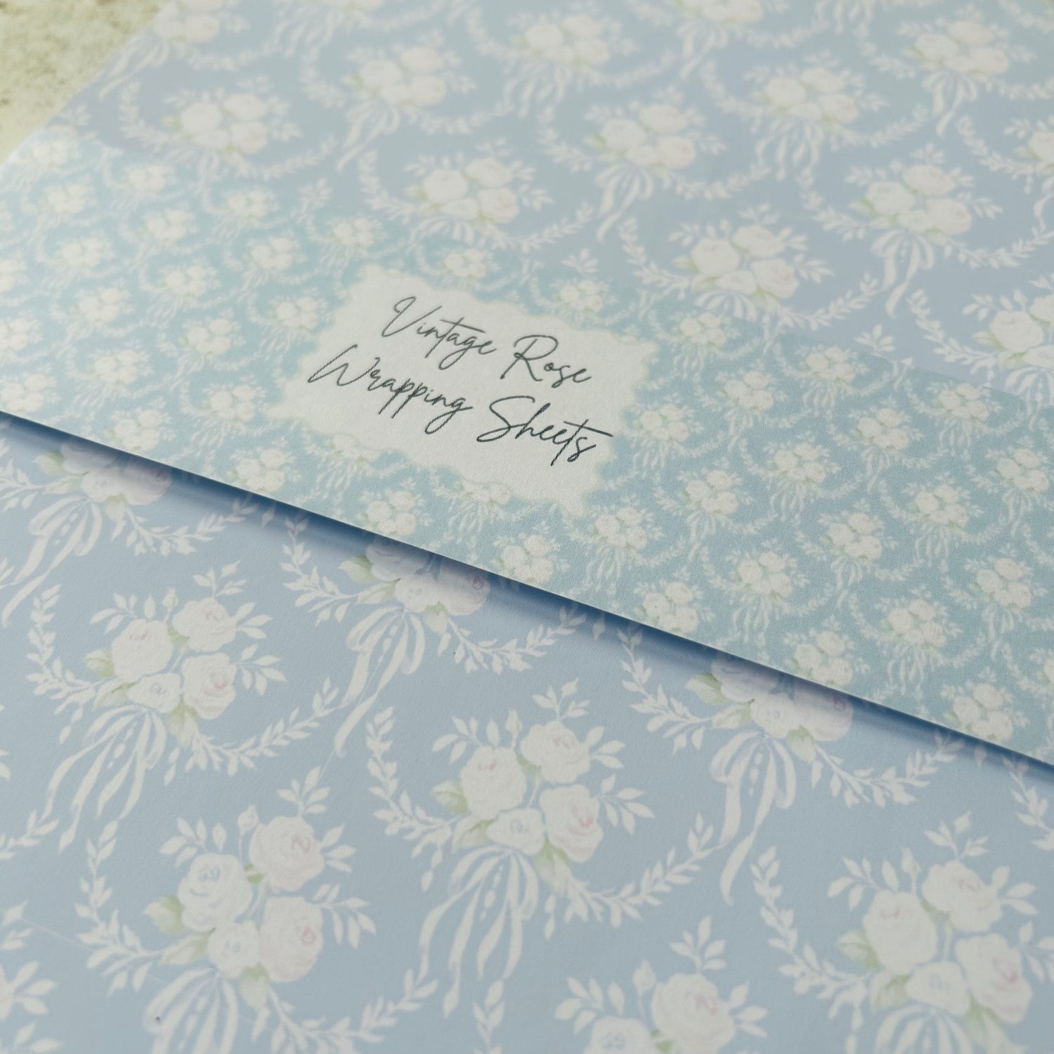Floral patterned wrapping paper with a label on a matching background