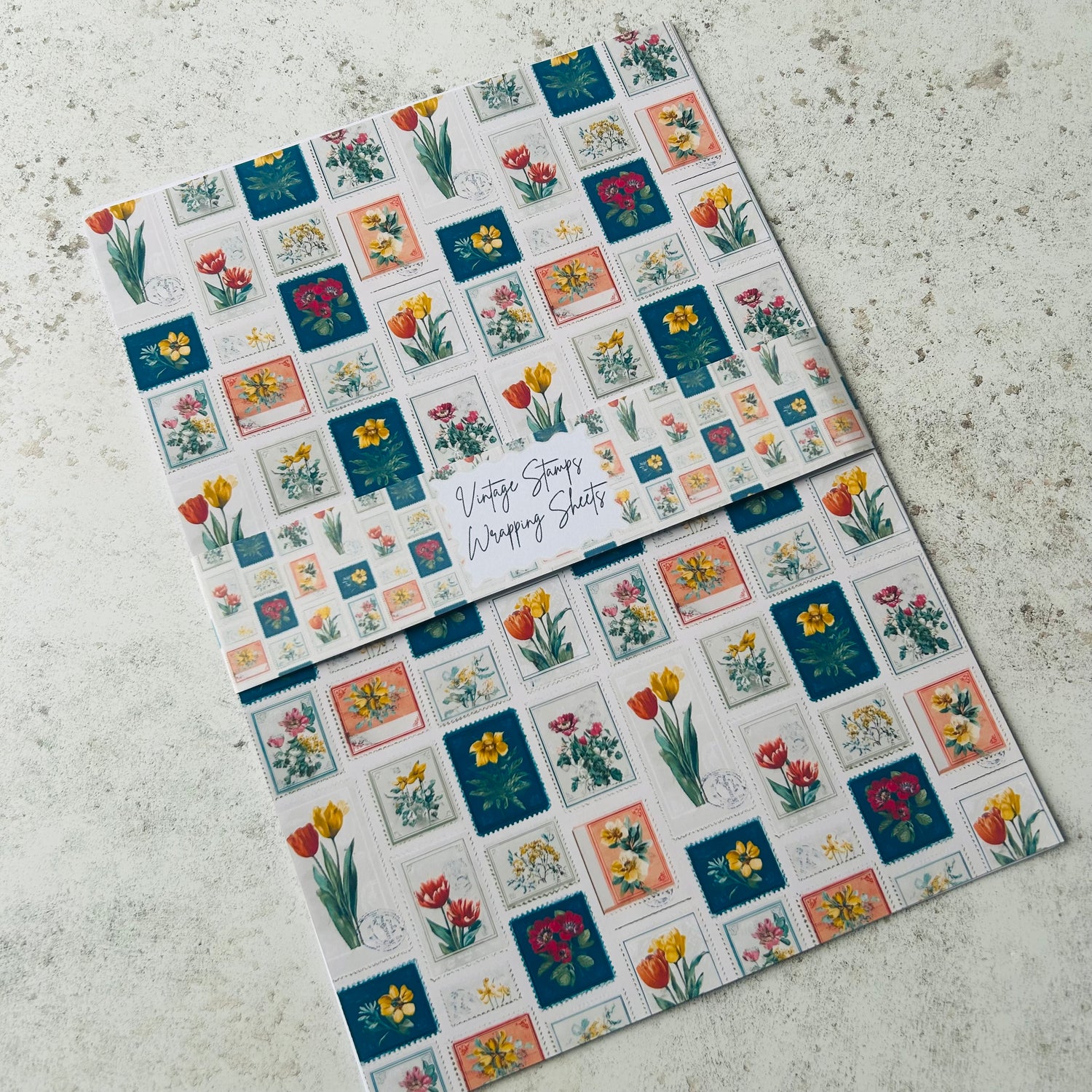 Sheet of vintage-style postage stamp designs on a textured surface