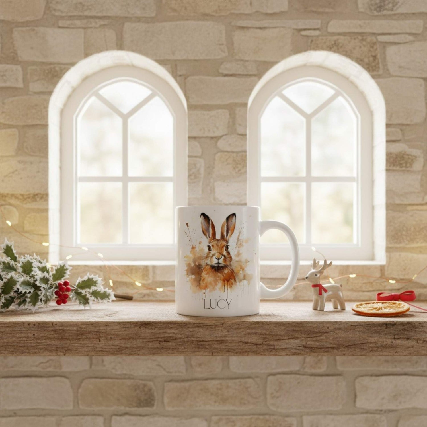 Mug with a hare design on a windowsill with decorative items