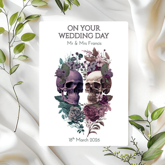 Wedding card with skulls and flowers on a white fabric background