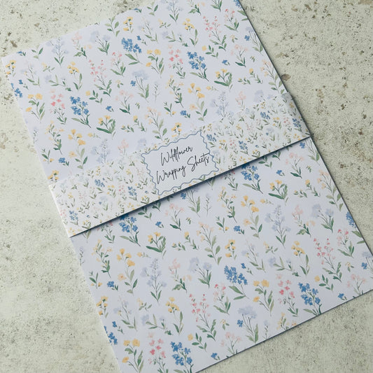 Floral-patterned paper sheets on a textured surface