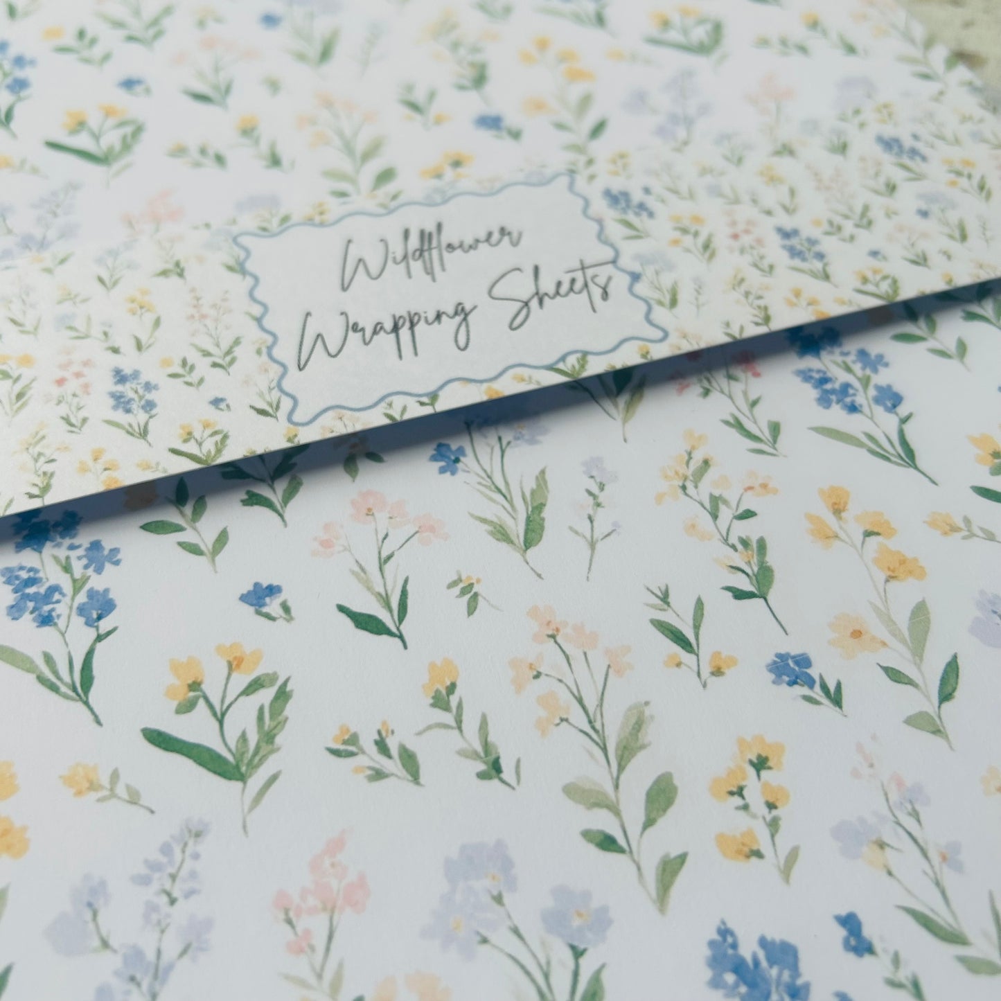 Floral wrapping paper with 'Wildflower Wrapping Sheets' text on a white background