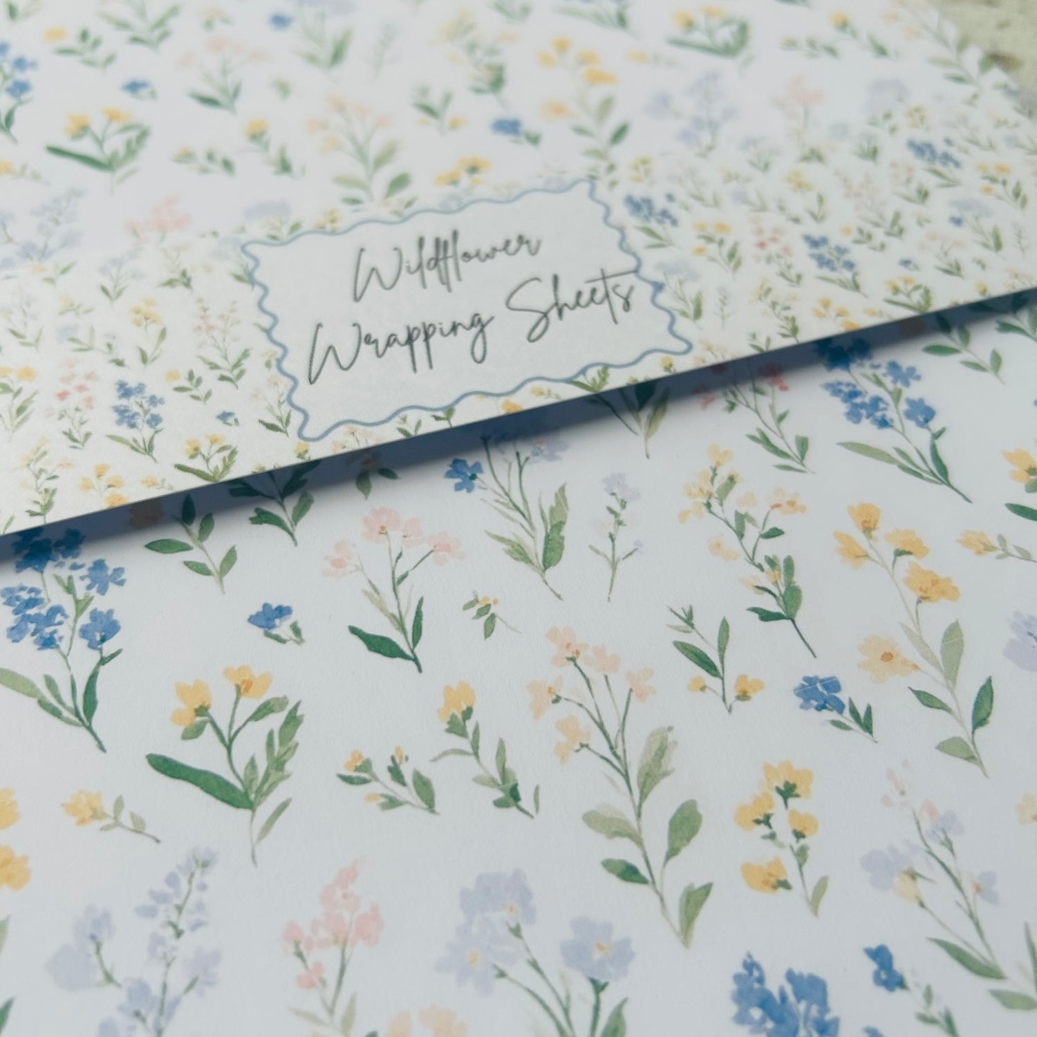 Floral wrapping paper with 'Wildflower Wrapping Sheets' text on a white background