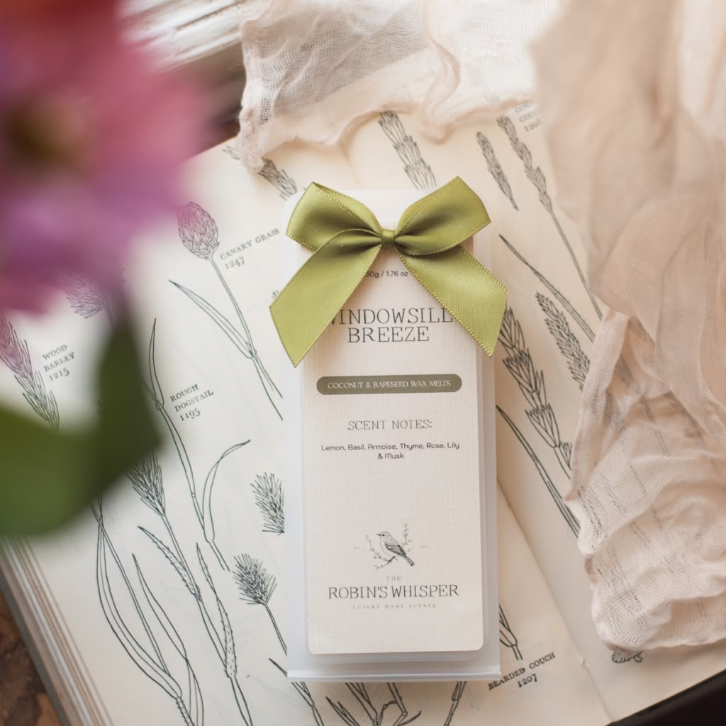 Product packaging of wax melts with a green bow on a floral-themed background